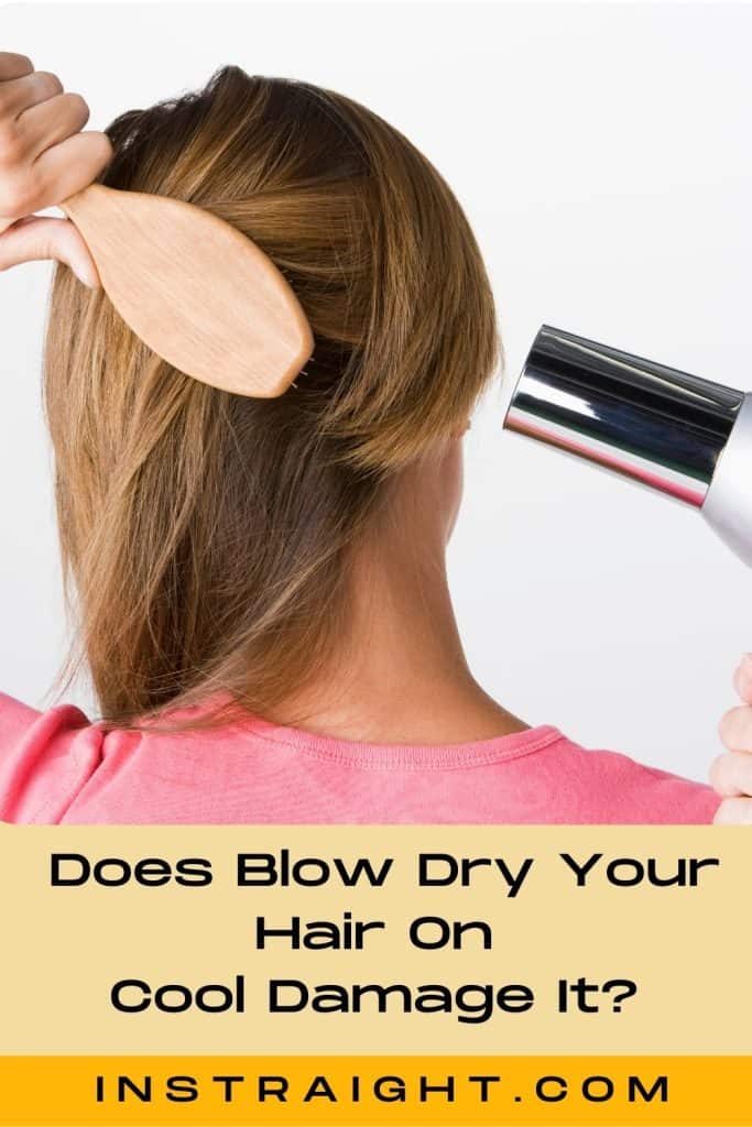 lady blow drying her hair